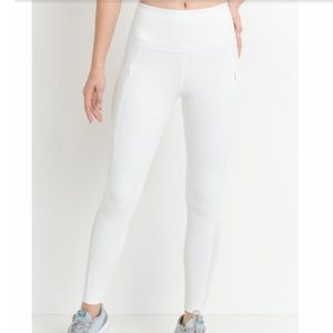 White leggings with zipper pockets